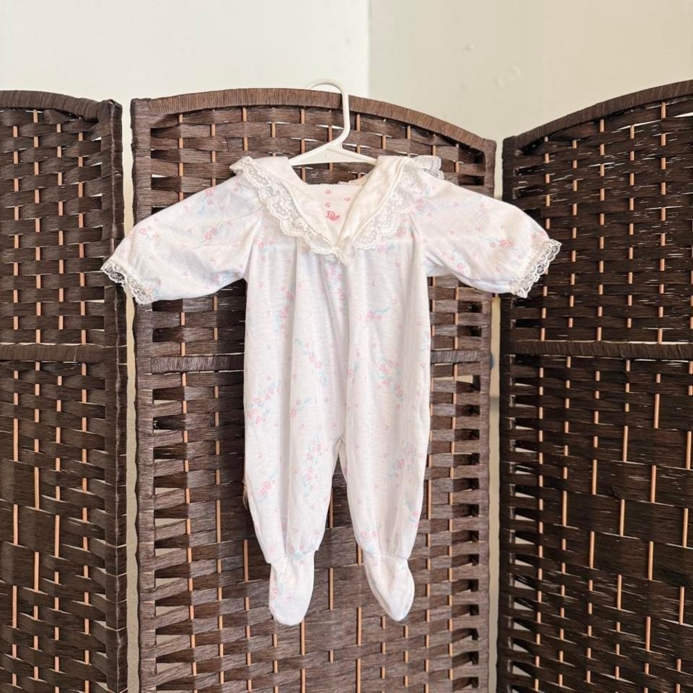 Baby Dior white babygrow with pink flowers and hearts. Size: 0-3 months